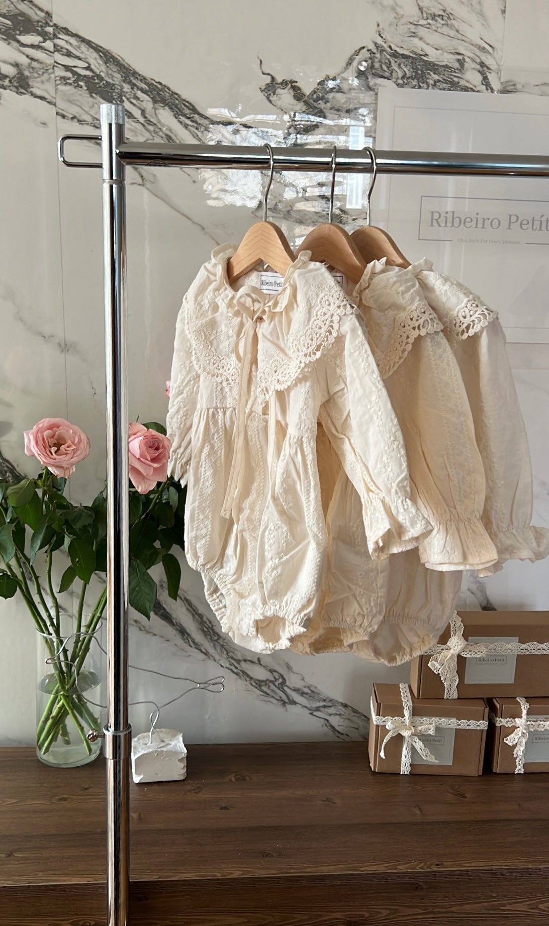 Elizabeth baby romper with a baby bonnet.